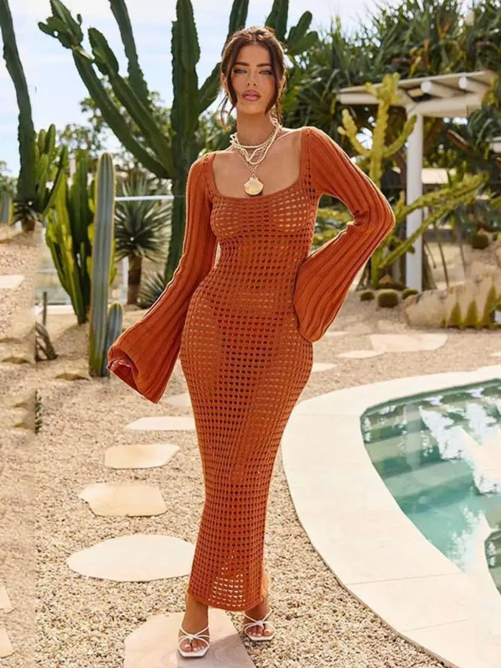 Openwork square neck flare sleeve cover-up dress in orange, featuring sheer fabric and a fitted silhouette, styled by a pool.
